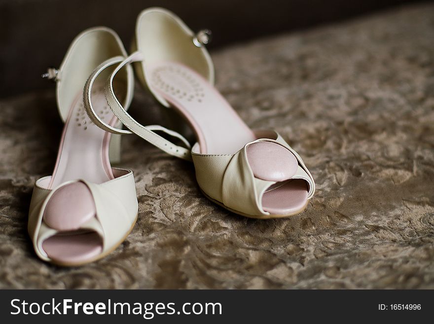 White brides shoes on carpet