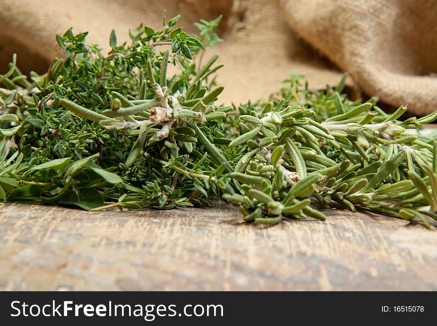 Macro fresh herbs on the old wooden table