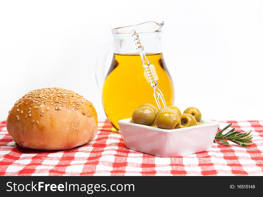 Olive oil, green olives and bread