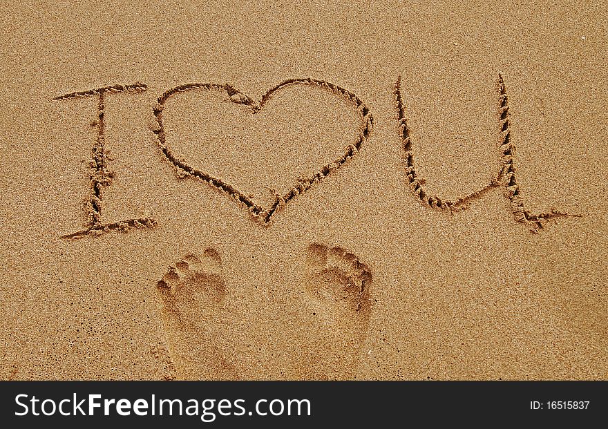 The word love written in sand