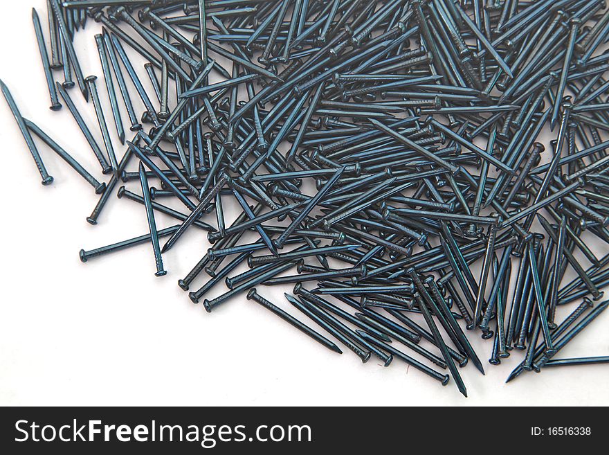 Heap of  Blue Concrete nails texture isolated on white