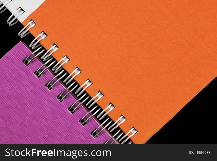 Colorful notebook as black background