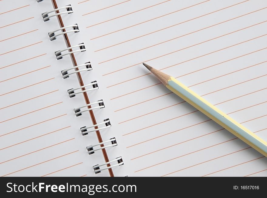 Blank notebook and pencil as white isolate background