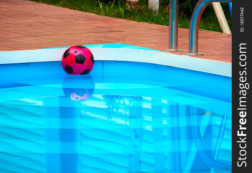 Ball is floating in swimming pool