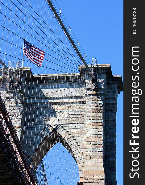 Looking up at the Brooklyn Bridge structure and suspension cables from the East River. Looking up at the Brooklyn Bridge structure and suspension cables from the East River