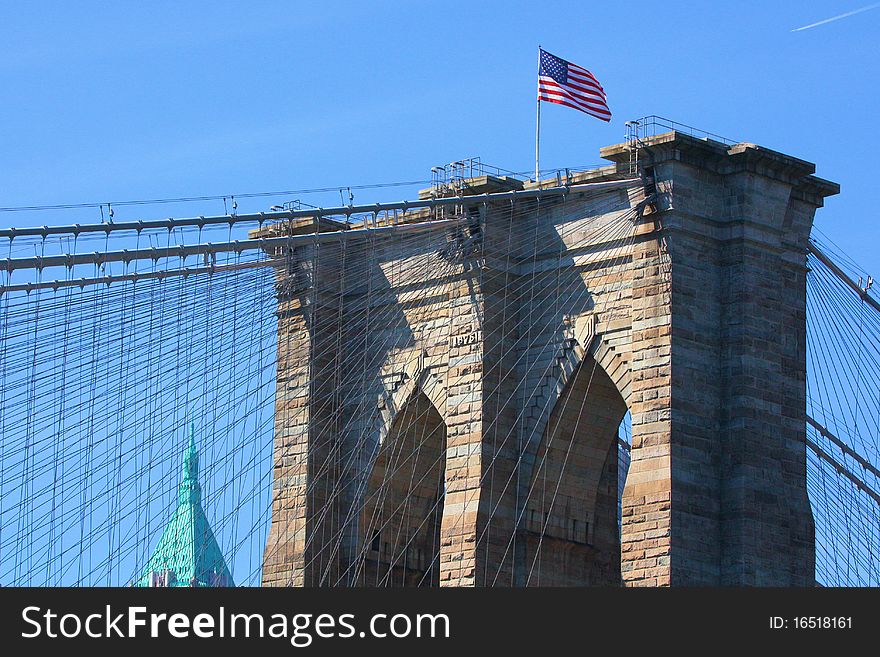 Looking up at the Brooklyn Bridge structure and suspension cables from the East River. Looking up at the Brooklyn Bridge structure and suspension cables from the East River