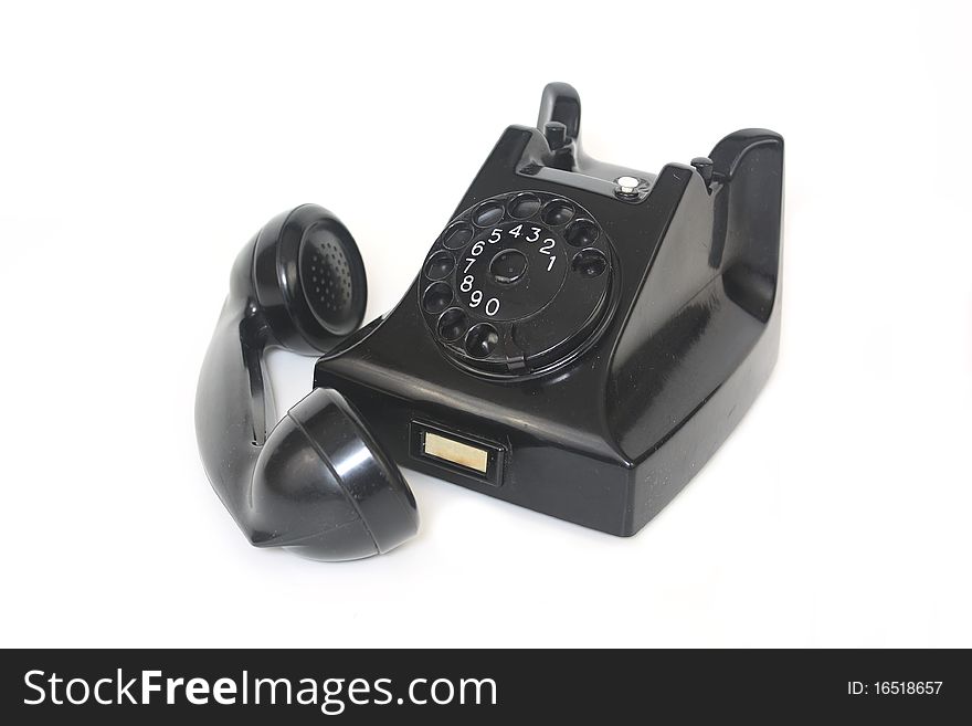 Black antique telephone with rotary dialling and receiver off. Black antique telephone with rotary dialling and receiver off