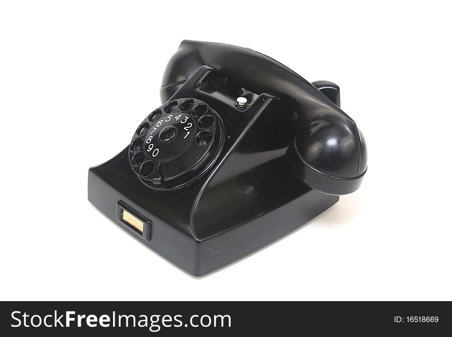 Black antique telephone side view with rotary dialling