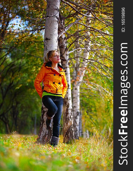 The girl in yellow in the autumn