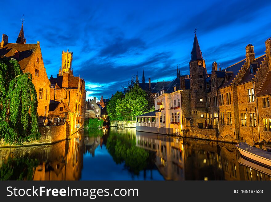 Belgium, Brugge, ancient European town with stone buildings on river, night view, glassy water surface. Tourism and travels, famous europe landmark, popular places, West Flanders. Belgium, Brugge, ancient European town with stone buildings on river, night view, glassy water surface. Tourism and travels, famous europe landmark, popular places, West Flanders