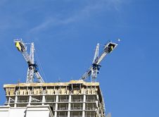Two Cranes Atop New Construction Royalty Free Stock Photo Two Cranes Atop New Construction Royalty Free Stock Photo