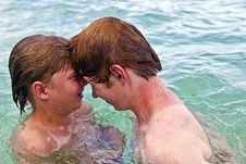 Boys Having Fun In The Clear Sea Royalty Free Stock Images