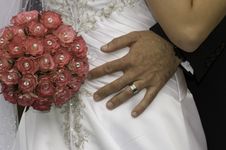 Groom With His Hand And Red Bouquet On His Bride Stock Photos