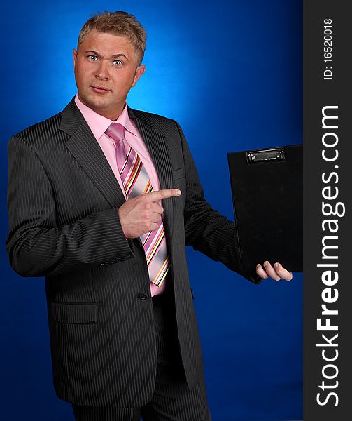 Businessman gesticulate on blue background