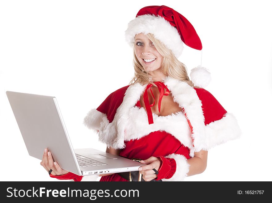 A female dressed as santas helper making a list on a laptop. A female dressed as santas helper making a list on a laptop.