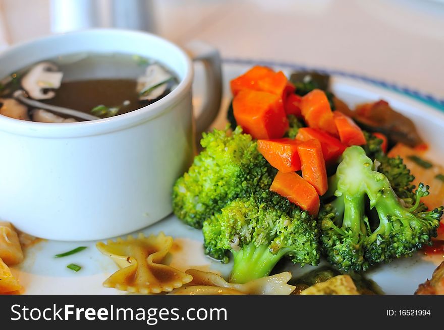 Green broccoli set meal with broiled mushroom soup for a healthy meal. Green broccoli set meal with broiled mushroom soup for a healthy meal.