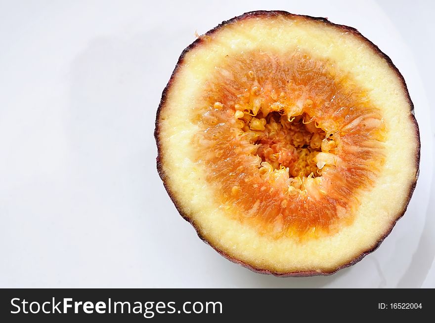 Cross section of fresh fig fruit showing interesting texture. For healthy lifestyle and fruit concepts. Cross section of fresh fig fruit showing interesting texture. For healthy lifestyle and fruit concepts.