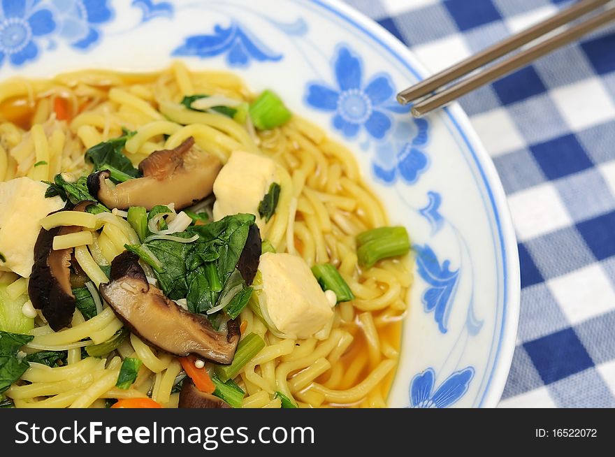 Chinese traditional soup cuisine with chopsticks.