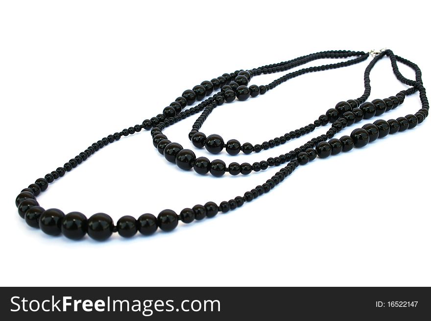 Black necklace isolated on white background.