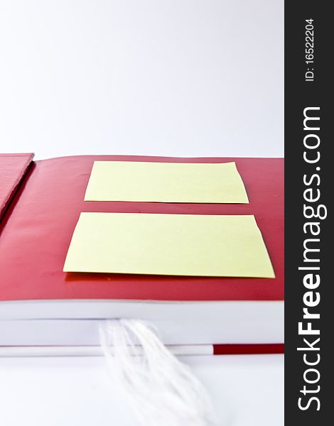 Yellow note on red notebook