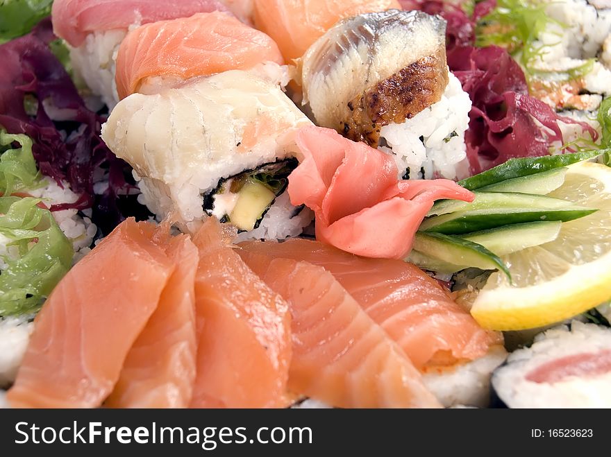 Composition of rolls, fish and vegetables. Composition of rolls, fish and vegetables