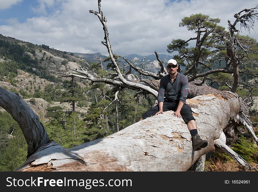 Person hiking the famous path GR20 at Corsica. Person hiking the famous path GR20 at Corsica.