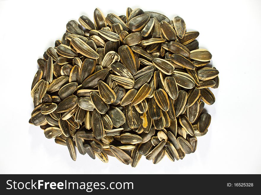 A pile of sunflower seeds isolated on white background