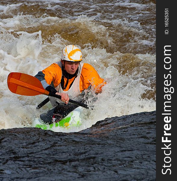 Acrobatic freestyle on whitewater in kayak