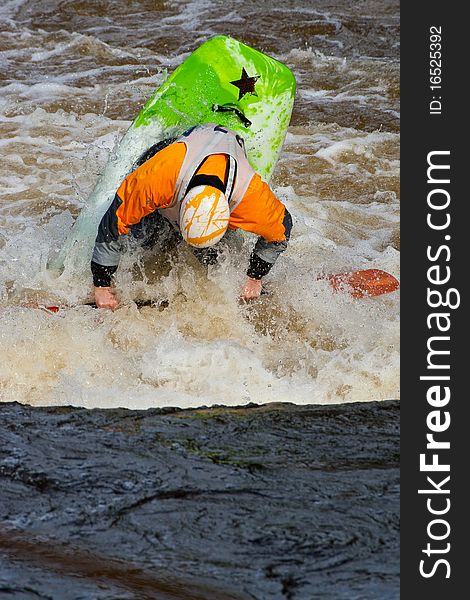 Acrobatic freestyle on whitewater in kayak