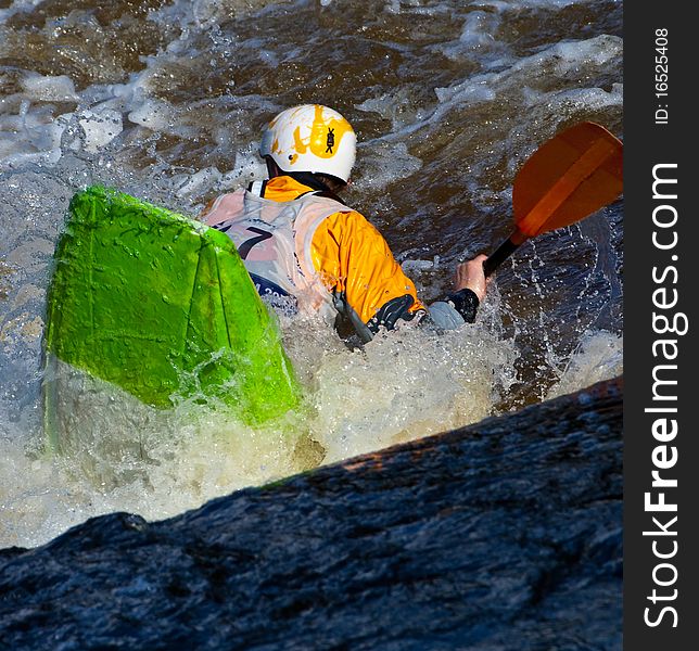 Acrobatic freestyle on whitewater in kayak