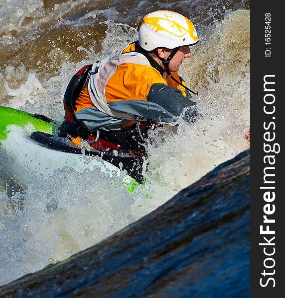 Acrobatic freestyle on whitewater in kayak