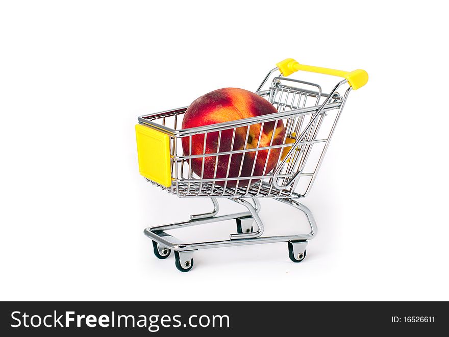 Shopping cart with a large peach on white background