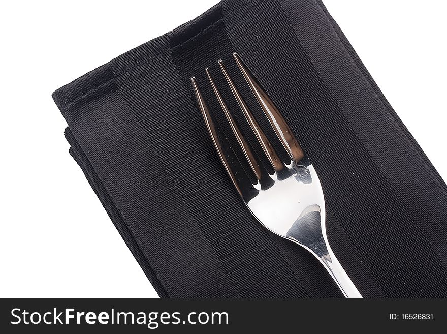 A fork with a black cloth from a fabric on a white background.