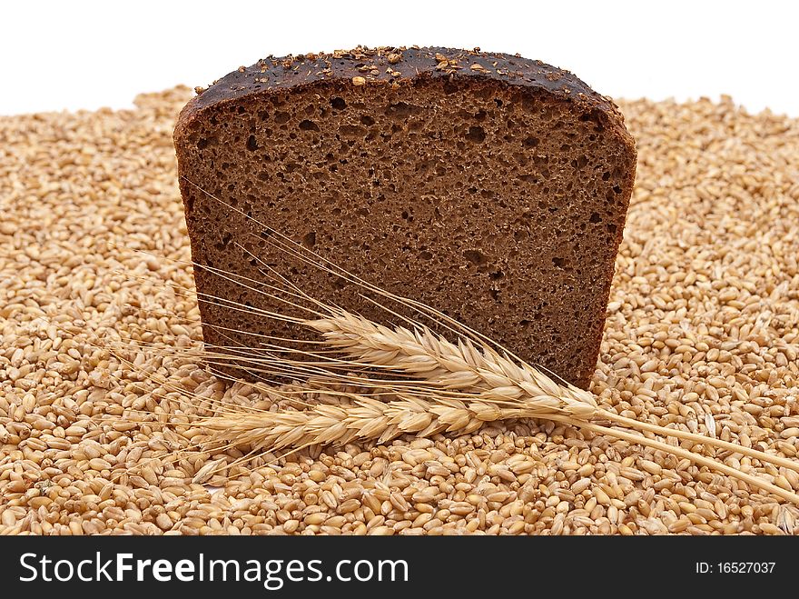 Bread with wheat and ears on white