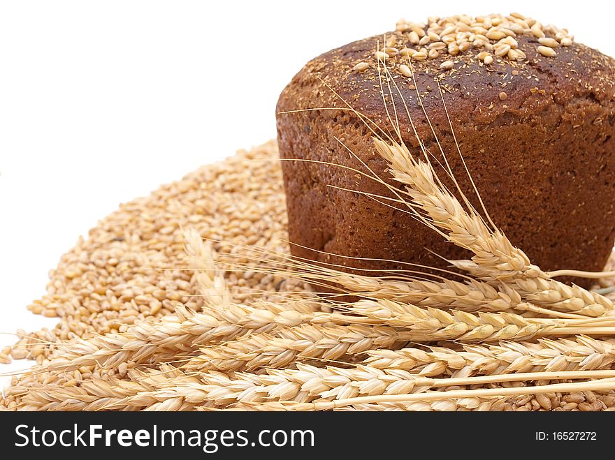 Bread with wheat and ears on white