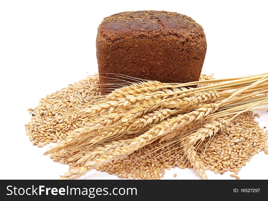 Bread with wheat and ears on white