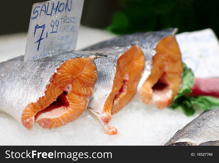 Fresh salmon in ice at the market