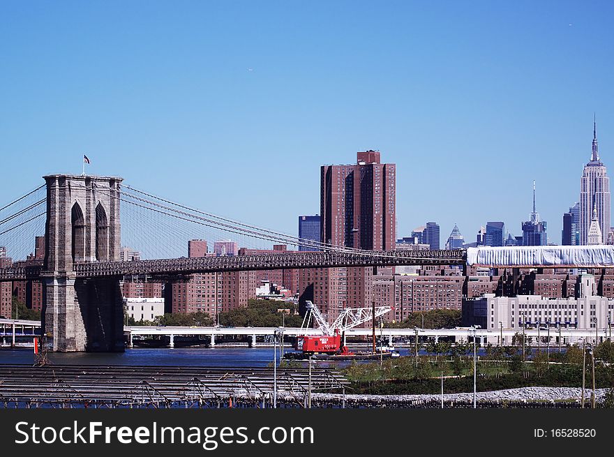 Brooklyn Bridge from brooklyn promnade in sunny day