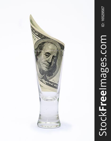 Dollar in glass on white background