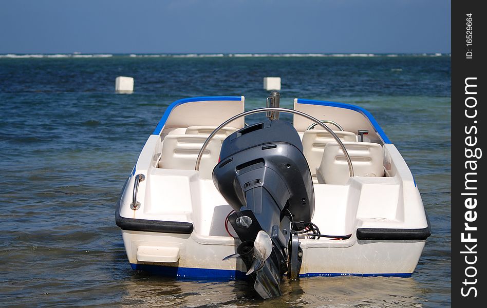 A motor boat in shallow waters of the indian ocean