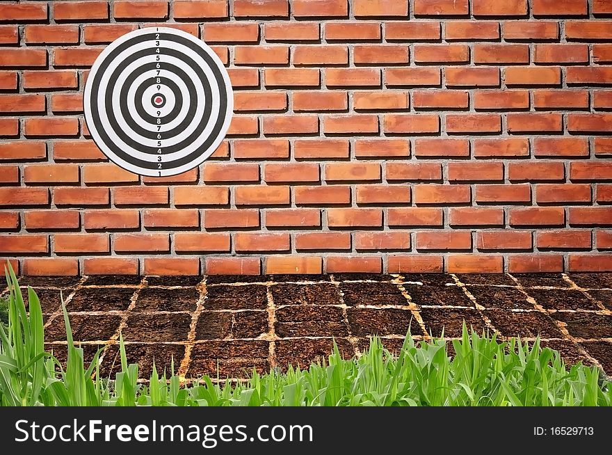 Target on brickwall pattern background
