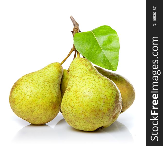 Yellow pears with leaf isolated on white