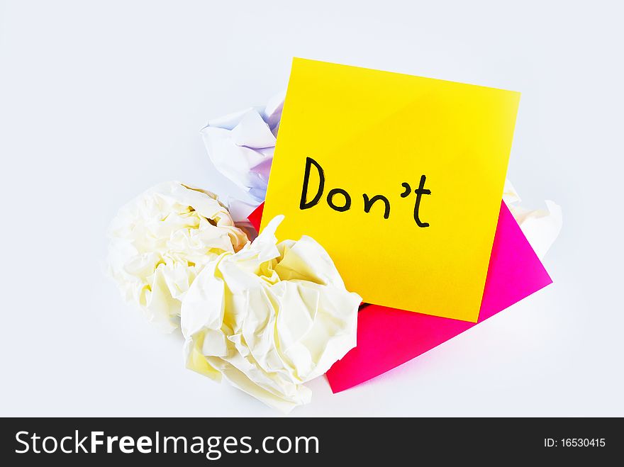 Wrinkled paper with note pad reminder don't isolated on white background