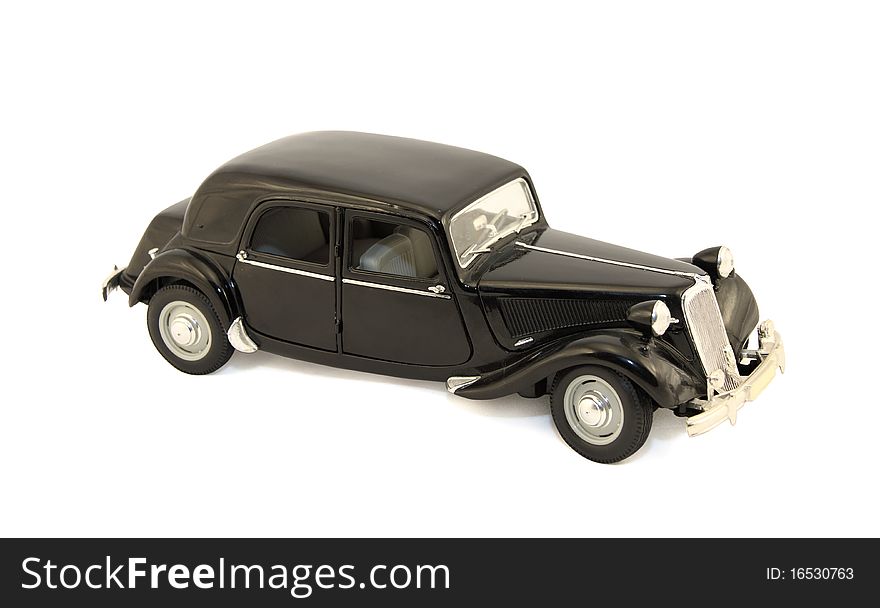 Black toy model of the old car with black wheels. Black toy model of the old car with black wheels