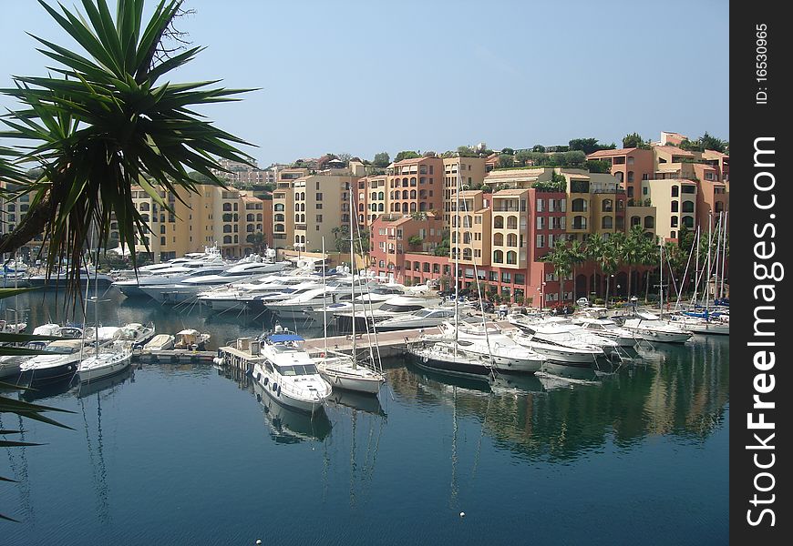 Calm water in a yachting marina in Monaco in summer. Calm water in a yachting marina in Monaco in summer