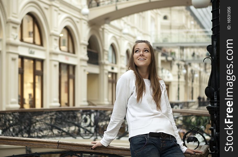 Attractive girl standing on the bridge in GUM. Attractive girl standing on the bridge in GUM