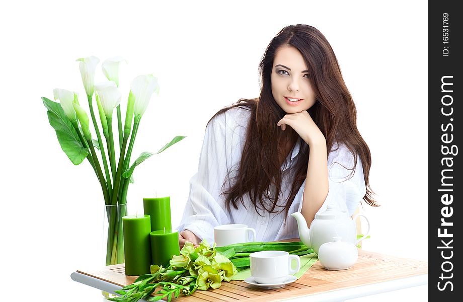 Beautiful woman in cafe over white background with flowers. Beautiful woman in cafe over white background with flowers