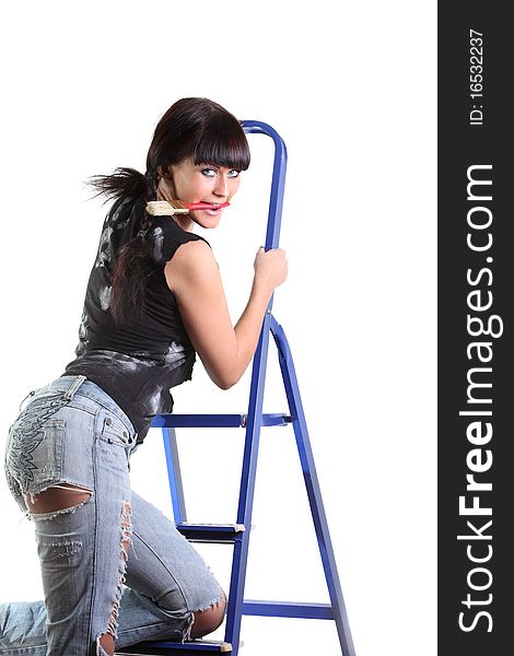 Girl hold brush by teeth and climb up to the stepladder. Girl hold brush by teeth and climb up to the stepladder