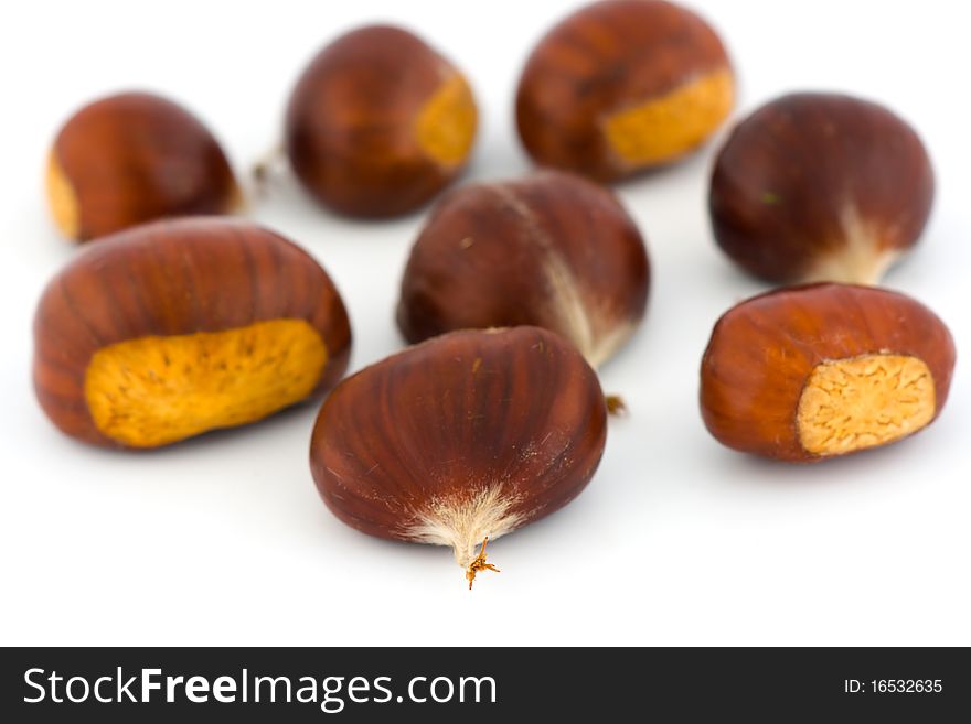 A closeup of chestnuts isolated on white