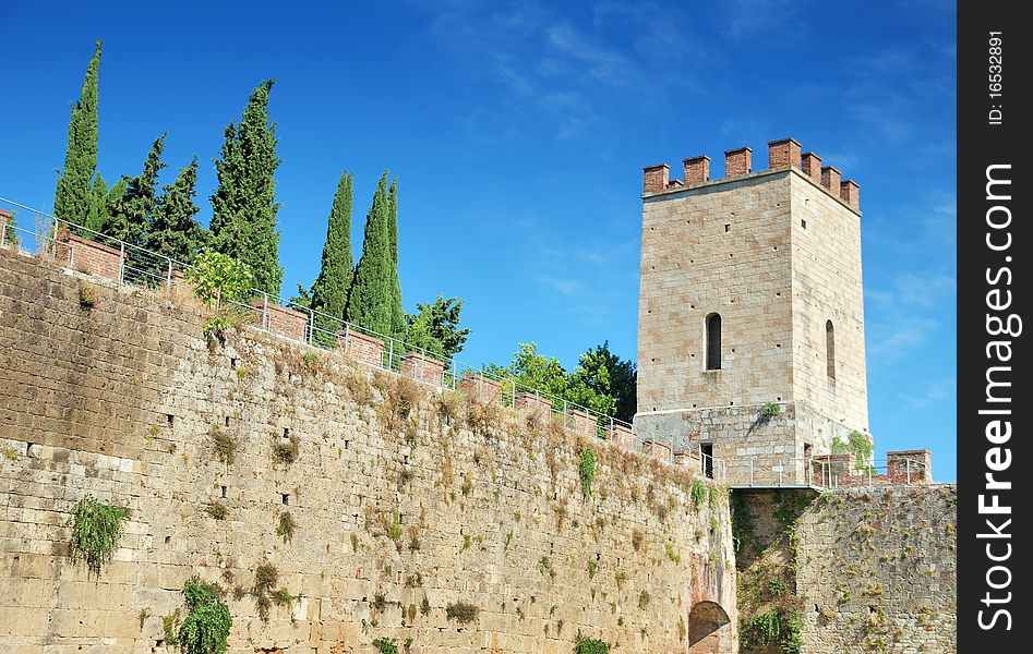 The watchtower and walls that surround the old city Pisa, Italy. The watchtower and walls that surround the old city Pisa, Italy.